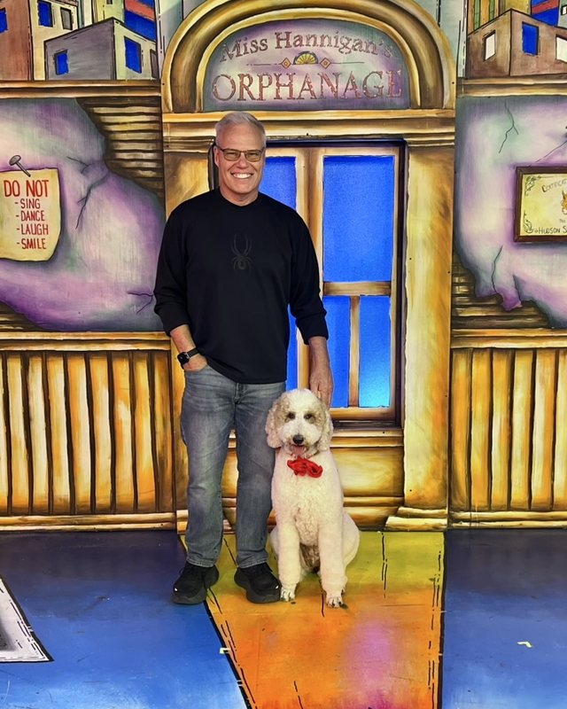 Michael Minik, founder of FirearmLog, with his dog Chelsea.